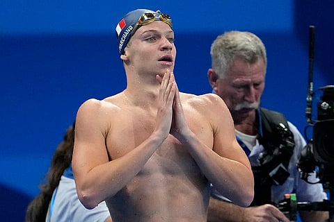 French swimmer Leon Marchand celebrates winning in 200-meter butterfly final